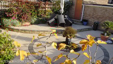 Fully paved multi-tier level garden with elevated raiesed patios and circles.