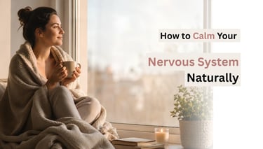 Woman drinking tea by a window as part of a calming nervous system support routine.