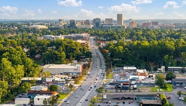 Aerial view of a multilane highway leading toward the urban downtown of Greenville SC