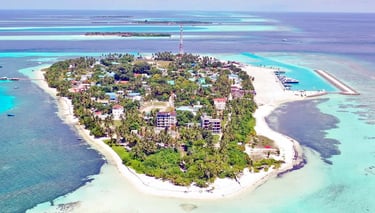 Dhangethi Island Maldives with white sandy beaches, clear waters, snorkeling, and local island life.