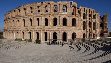 Roman ruins at Dougga, Sahara desert camel ride, and traditional desert campfire experience in Tunis
