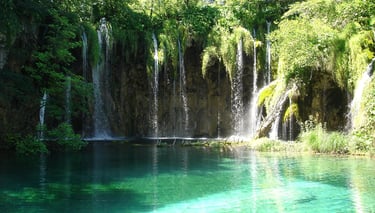 Overnight tour visiting Plitvice National Park and Zadar, including hotel breakfast start.