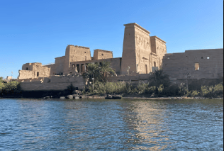 Aswan cityscape showcasing temples, the Nile, and the High Dam.