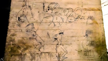 Historic 1914 charcoal graffiti drawings on a concrete pillar inside the Lincoln Memorial Undercroft, Washington DC.