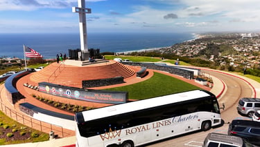 A Royal Lines Charters tour bus parked at the Mt. Soledad National Veterans Memorial in La Jolla.