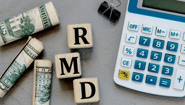 a calculator paperclip and money for required minimum distributions