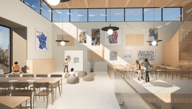 espace d'activité avec des tables et un espace jeux avec un tableau blanc