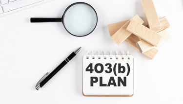 magnifying glass a pen and blocks for 403b plans