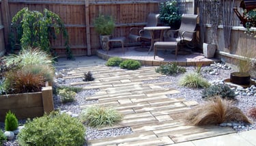 Rustic driftwood beach effect small garden with water feature