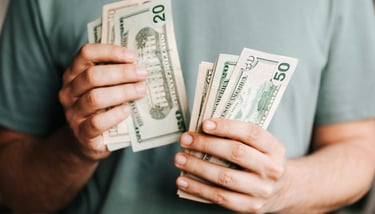 cash in someones hand for augusta precious metals fees