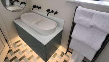 Close-up of modern sink installation with chrome mixer tap by PBP Services