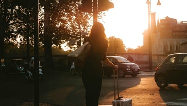 A lady passenger exiting Airport and walking towards her pre-booked taxi from Dibrugarh Taxi 24x7.