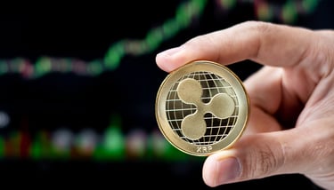 ripple xrp token in someones hands with charts in background