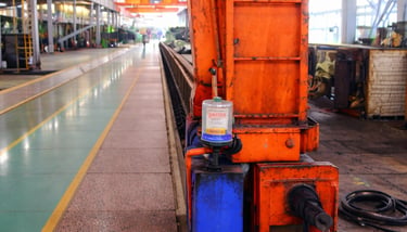 Single point automatic lubricator applied on crane bearing in industrial workshop