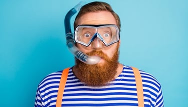 a bearded bearded man with a beard and a diving mask