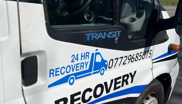 alt="Vehicle being recovered at night in Malvern"