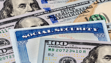 a hundred dollar bill and social security card for social security benefits