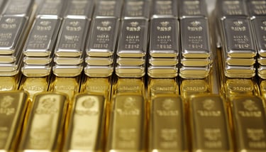 gold and silver bullion bars in rows and stacks