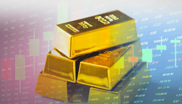 gold bullion bars in a pile with candlesticks and chart data