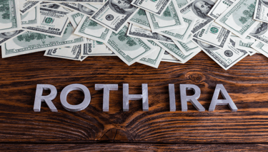 lots of money in a pile for the word roth ira