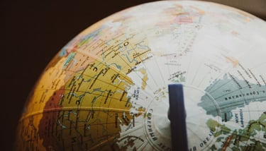 globe showing different countries and nations representing Gold IRA and geopolitical risk