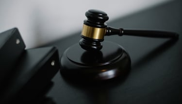 a gavel on a desk showing gold ira regulations and compliance