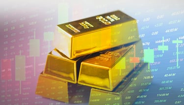 gold bullion bars in a pile with candlesticks and chart data