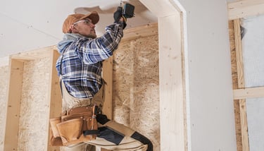 General contractor making repairs on a wall.