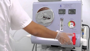Professional colon hydrotherapy machine being operated by a technician for detoxification.