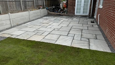 Patio slabbing installation in a Worcester garden by B R Building and Landscapes
