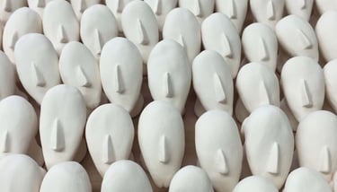 Tiny porcelain heads with big noses