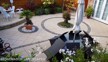 Fully paved multi-tier level garden with elevated raiesed patios and circles.