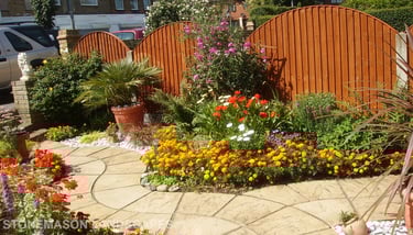 Curvey winding path, circle kits paving slabs weaving through lots of beautiful plants & flowers