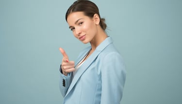 a woman in a blue suit and tie dye