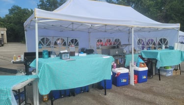 a tent with a table set up for a party