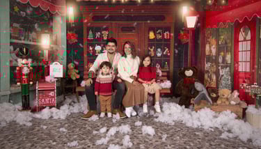 a family posing for a photo in a christmas card