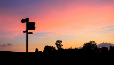 Signpost in sunset