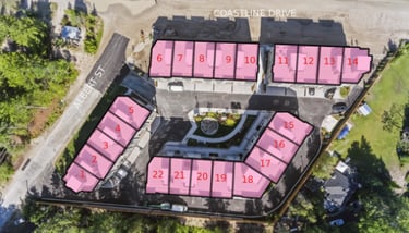 Aerial view of a townhouse development site plan with numbered residential units and nearby roads.