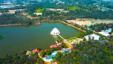 Aerial view of Udon Thani, Thailand, showing temple in a man made lake.