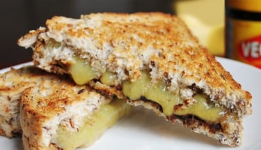 a sandwich with cheese and vegemite on it. Australian vegemite