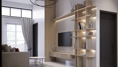 Interior ruang keluarga rumah Andara Maharupa Village luas dan terang