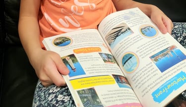 Toronto city guide & journal in child's lap