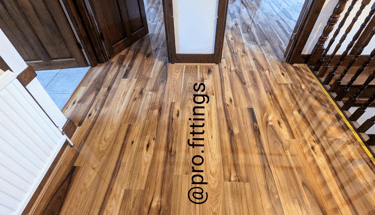 Gloss laminate flooring fitted in Stratford by Pro Fittings Ltd