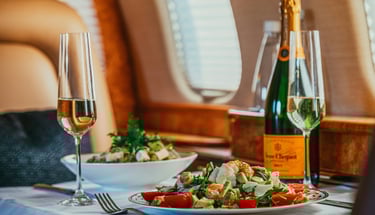 a table with a bottle of champagne and a bottle of wine