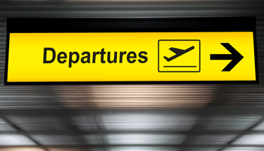 a sign board with a direction sign pointing to the left