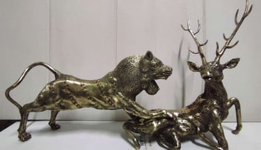 "Wildlife-themed brass artwork showing lion attacking deer-Prepared for export"