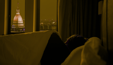 A person sleeping peacefully in cozy bedroom night sky– deep sleep self-care and wellness healing.