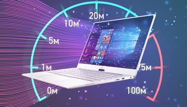 A white Dell XPS laptop displayed over a colorful internet speed test gauge showing high performance.
