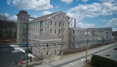 a large building with a clock tower in the middle of it