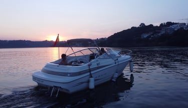Private cabin cruiser cruising on the Douro River in Porto